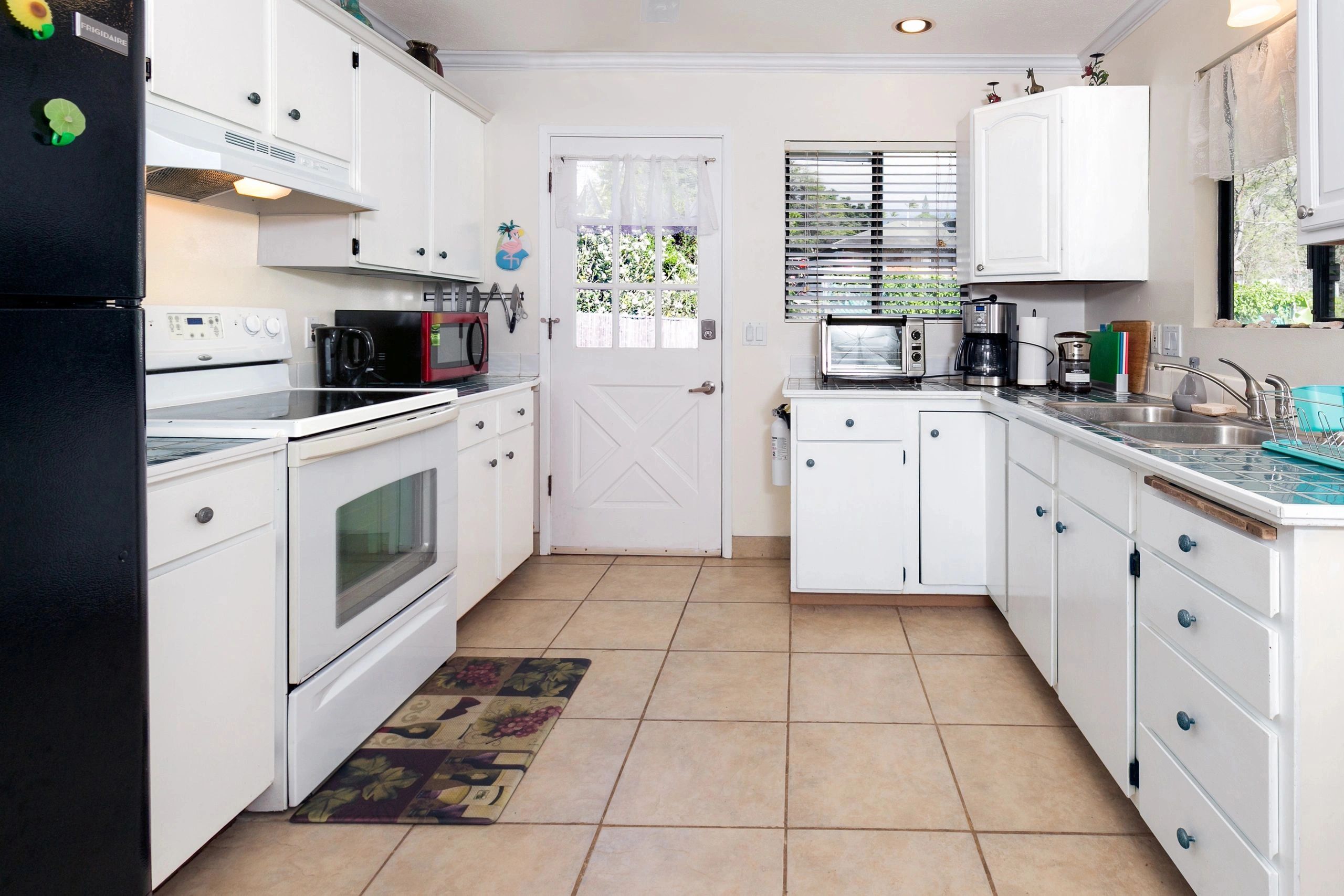 Palm Cottage bathroom with teal tile